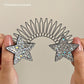 Peigne flexible « Invisible Grip » pour cheveux rebelles